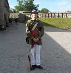Historic interpreter dressed as a member of the militia. Fort Erie